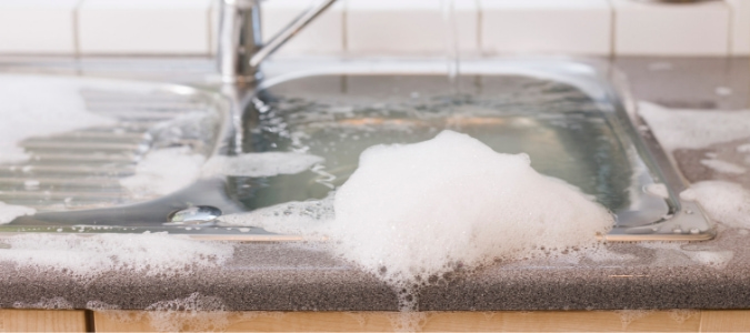 Sink overflowing with water because the garbage disposal won't turn on