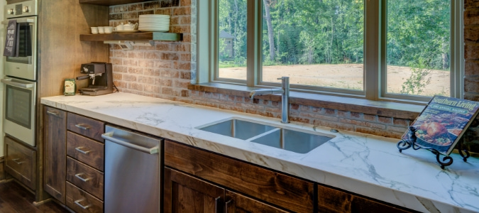 Kitchen with a new sink and garbage disposal