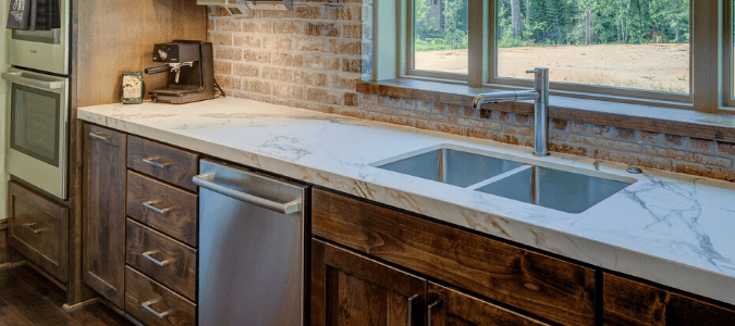 a kitchen with a sink and dishwasher