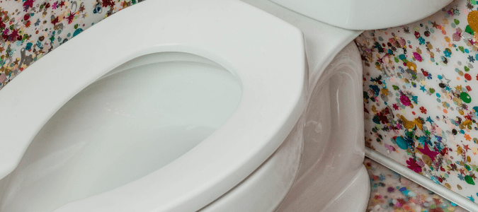 a toilet bowl that is slowly draining