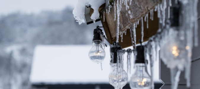 snow and icicles on a roof