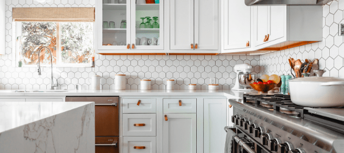 White kitchen with marble counter tops