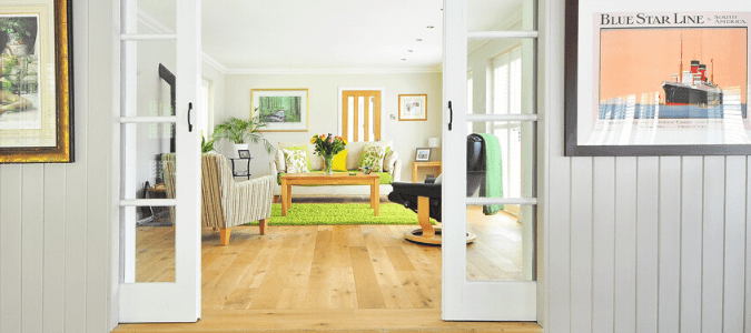 A living room with hardwood floor and termites in furniture