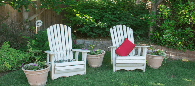 A backyard with lots of greenery that might make a homeowner wonder: do mosquito foggers work