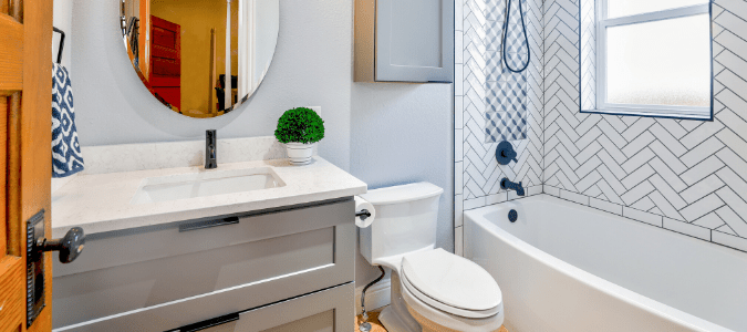 A toilet with an overflowing tank in a light gray bathroom