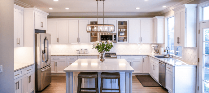 AC blowing warm air into a white kitchen