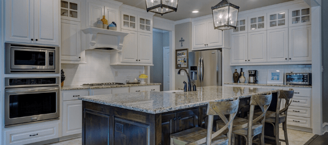 A white and gray kitchen with an ac that won't run