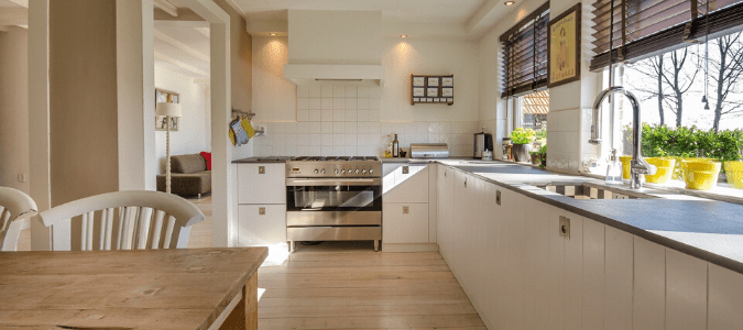 A kitchen with a dining area that would benefit from an ion exchange type of water softener