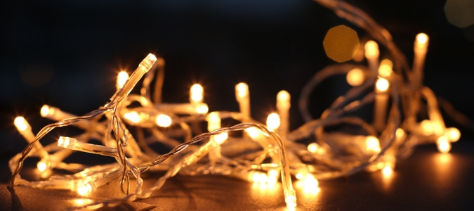 Lights laid out for holiday decorating, which has led a homeowner to wonder how to hang Christmas lights on a metal roof