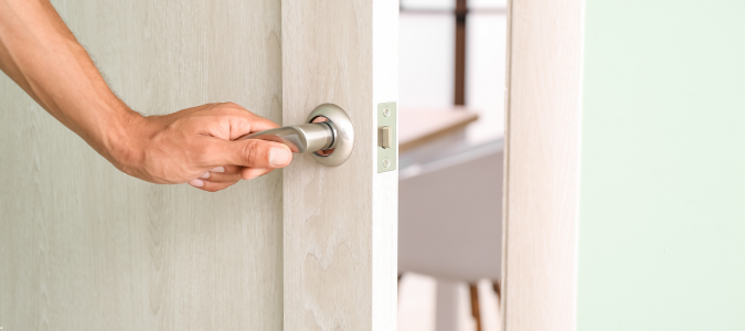 a person opening a door